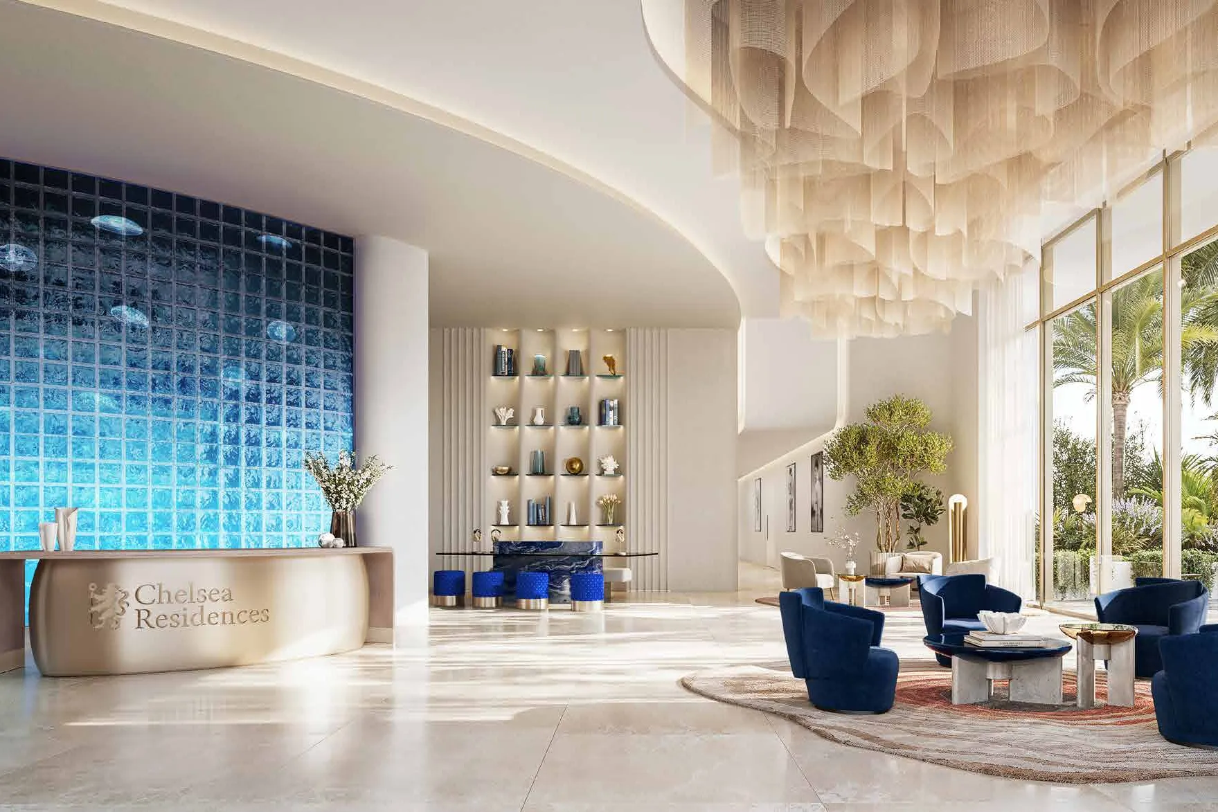 Bright lobby with blue glass wall, reception desk and navy armchairs